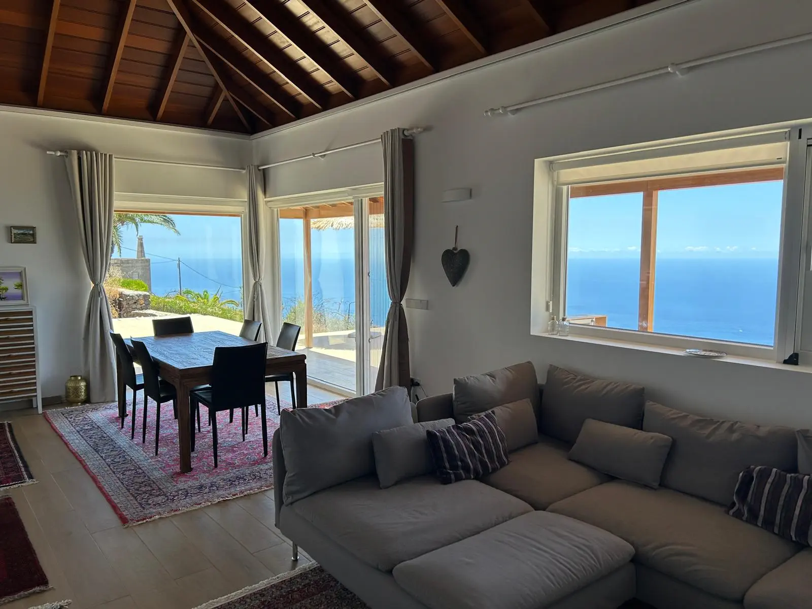 Bright Casa Arash living room and kitchen with a wooden ceiling